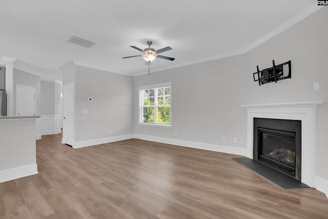 386 Amalfi Dr, Chapin, SC 29036 - unfurnished living room featuring crown molding, light wood-type flooring, ceiling fan, and a glass covered fireplace