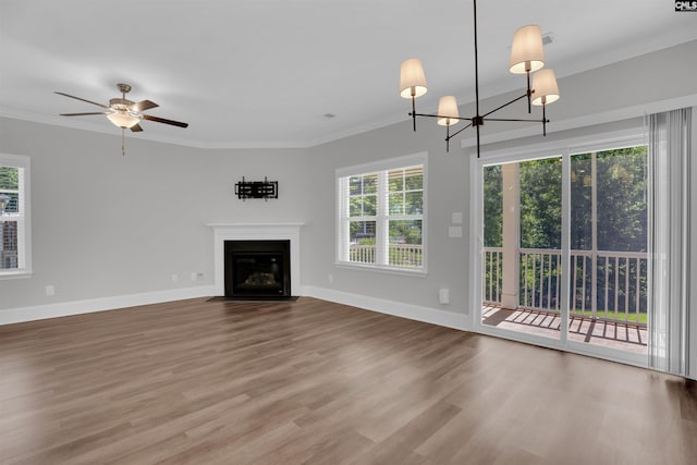386 Amalfi Dr, Chapin, SC 29036 - unfurnished living room with plenty of natural light, a fireplace with flush hearth, wood finished floors, crown molding, and ceiling fan