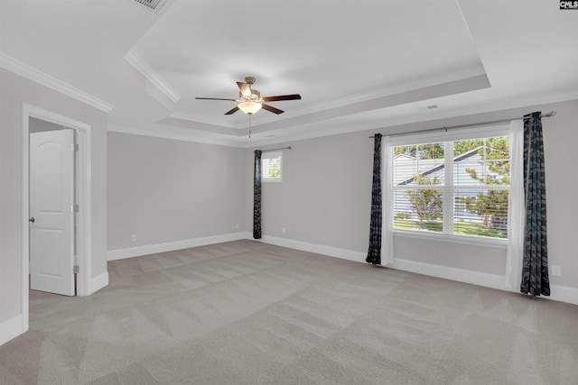 386 Amalfi Dr, Chapin, SC 29036 - spare room with a raised ceiling, light colored carpet, crown molding, and a ceiling fan