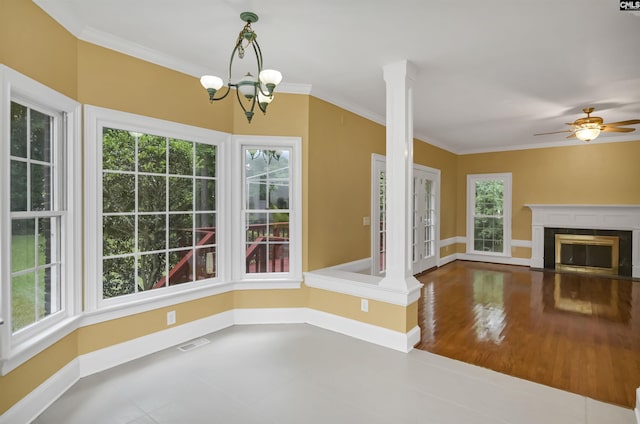 256 Sheringham Rd, Columbia, SC 29212 - unfurnished dining area featuring crown molding, ceiling fan, a fireplace with flush hearth, a chandelier, and wood finished floors