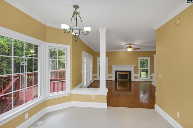 256 Sheringham Rd, Columbia, SC 29212 - unfurnished living room featuring ceiling fan, a fireplace, crown molding, decorative columns, and a chandelier