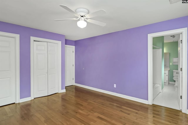 256 Sheringham Rd, Columbia, SC 29212 - unfurnished bedroom with wood finished floors, ceiling fan, and connected bathroom