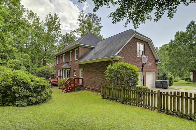 256 Sheringham Rd, Columbia, SC 29212 - view of home's exterior featuring an attached garage, brick siding, driveway, a deck, and roof with shingles