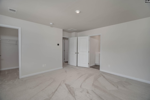 1021 Bermuda Cedar Ln, Hopkins, SC 29061 - unfurnished bedroom featuring carpet floors, a spacious closet, and ensuite bath