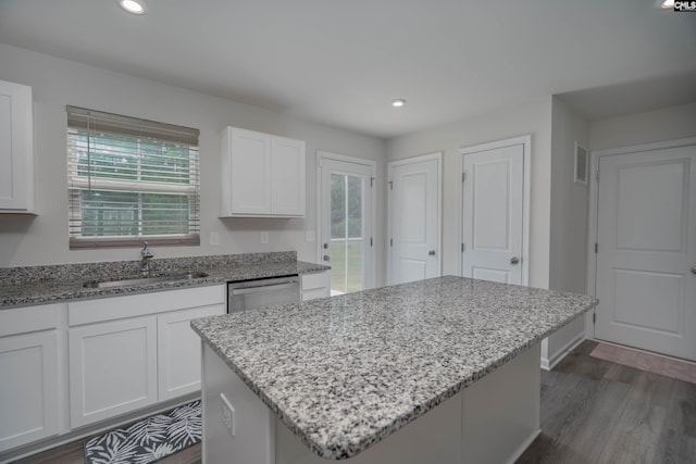 1021 Bermuda Cedar Ln, Hopkins, SC 29061 - kitchen featuring healthy amount of natural light, white cabinets, dark wood-style flooring, light stone countertops, and recessed lighting