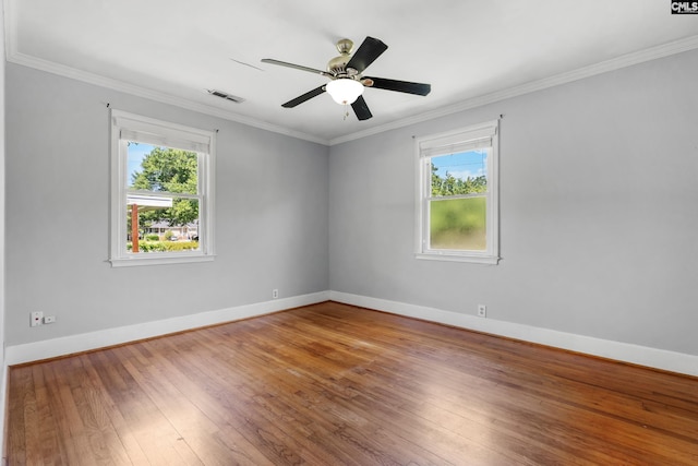 1400 Axtell Dr, Cayce, SC 29033 - spare room featuring plenty of natural light, wood-type flooring, ornamental molding, and a ceiling fan