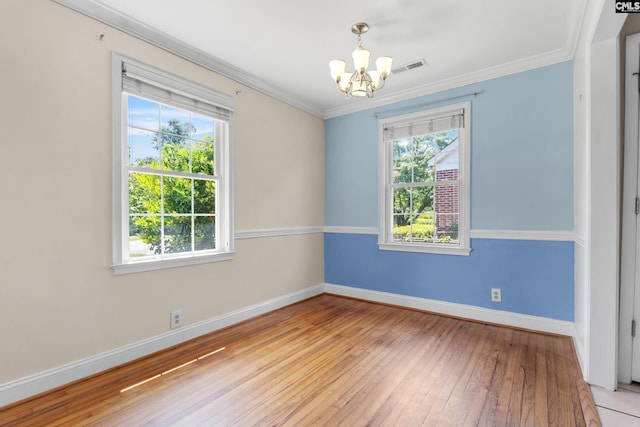 1400 Axtell Dr, Cayce, SC 29033 - spare room with a chandelier, healthy amount of natural light, light wood finished floors, and crown molding