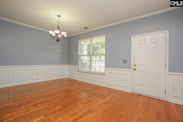 418 Abbeydale Way, Columbia, SC 29229 - empty room with a chandelier, crown molding, light wood-type flooring, and a wainscoted wall