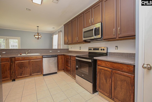 418 Abbeydale Way, Columbia, SC 29229 - kitchen featuring appliances with stainless steel finishes, healthy amount of natural light, ornamental molding, light tile patterned floors, and decorative light fixtures