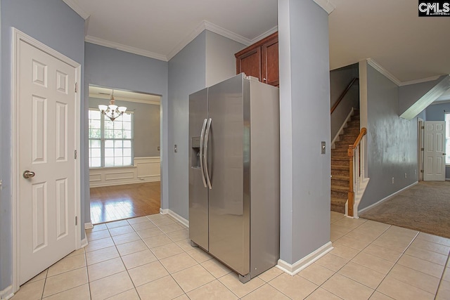 418 Abbeydale Way, Columbia, SC 29229 - kitchen featuring stainless steel fridge with ice dispenser, light tile patterned flooring, a chandelier, and ornamental molding