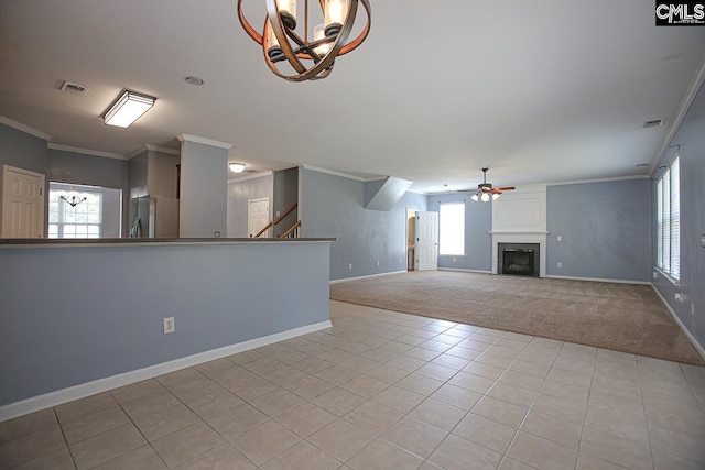 418 Abbeydale Way, Columbia, SC 29229 - unfurnished living room with a ceiling fan, ornamental molding, healthy amount of natural light, light carpet, and a chandelier