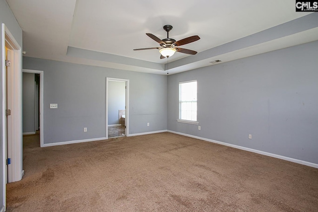 418 Abbeydale Way, Columbia, SC 29229 - unfurnished bedroom featuring a raised ceiling, carpet floors, connected bathroom, and ceiling fan