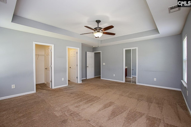 418 Abbeydale Way, Columbia, SC 29229 - unfurnished bedroom with a raised ceiling, carpet floors, a spacious closet, connected bathroom, and a ceiling fan