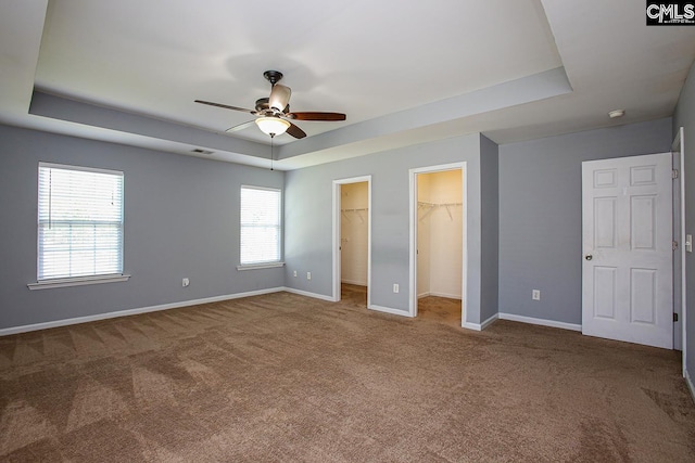 418 Abbeydale Way, Columbia, SC 29229 - unfurnished bedroom with a raised ceiling, carpet flooring, a walk in closet, and a ceiling fan