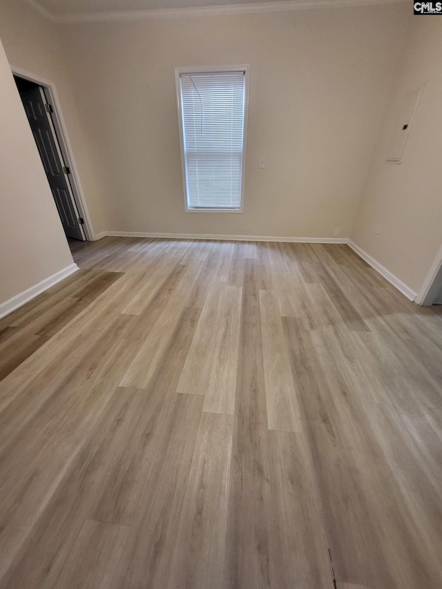 337 Mill St, Batesburg, SC 29006 - spare room featuring light wood-type flooring and crown molding