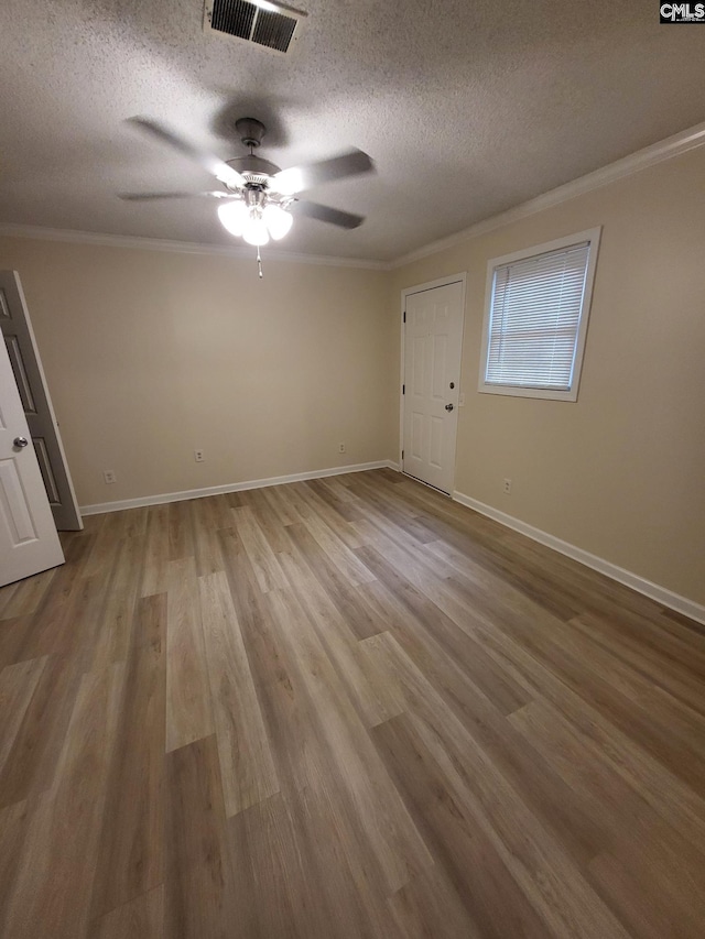 337 Mill St, Batesburg, SC 29006 - empty room with a ceiling fan, ornamental molding, a textured ceiling, and wood finished floors