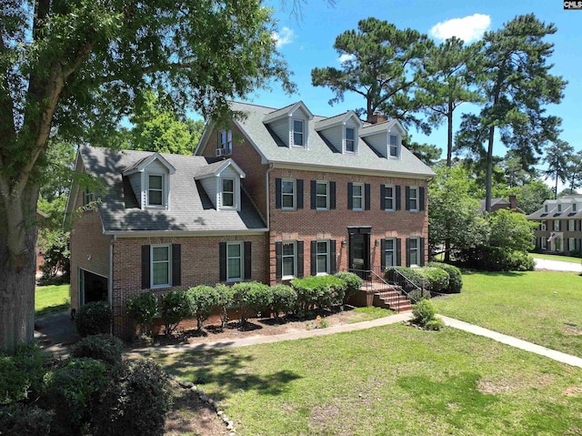 200 Weeping Cherry Ln, Columbia, SC 29212 - view of front of house featuring brick siding, a front lawn, roof with shingles, and a chimney