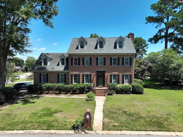200 Weeping Cherry Ln, Columbia, SC 29212 - view of front of house featuring a chimney, brick siding, and a front yard