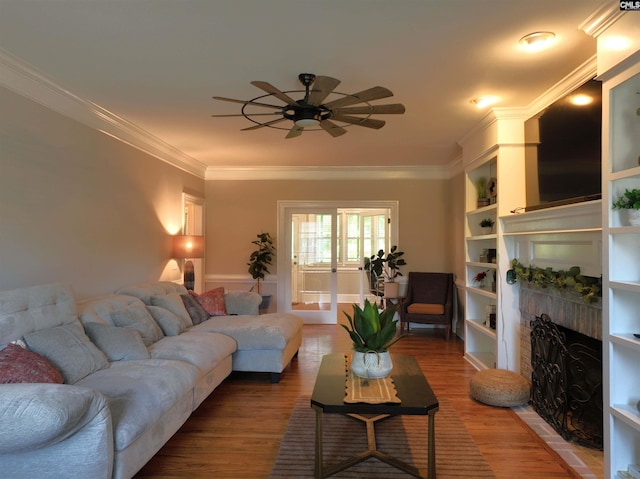 200 Weeping Cherry Ln, Columbia, SC 29212 - living area with a ceiling fan, wood finished floors, crown molding, and a fireplace with flush hearth