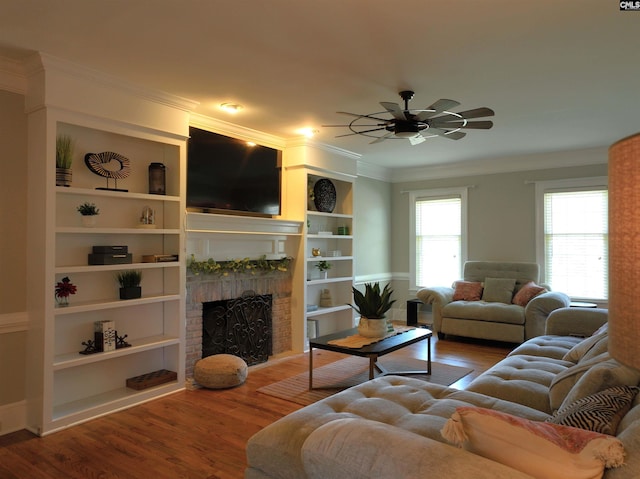 200 Weeping Cherry Ln, Columbia, SC 29212 - living area featuring wood finished floors, a fireplace, ceiling fan, built in features, and crown molding