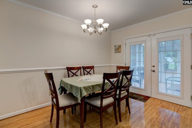 122 Halling Dr, Columbia, SC 29229 - dining room with ornamental molding, light wood finished floors, a chandelier, and french doors