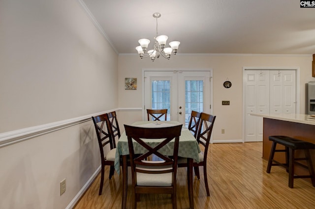 122 Halling Dr, Columbia, SC 29229 - dining space featuring a chandelier, ornamental molding, light wood finished floors, and french doors