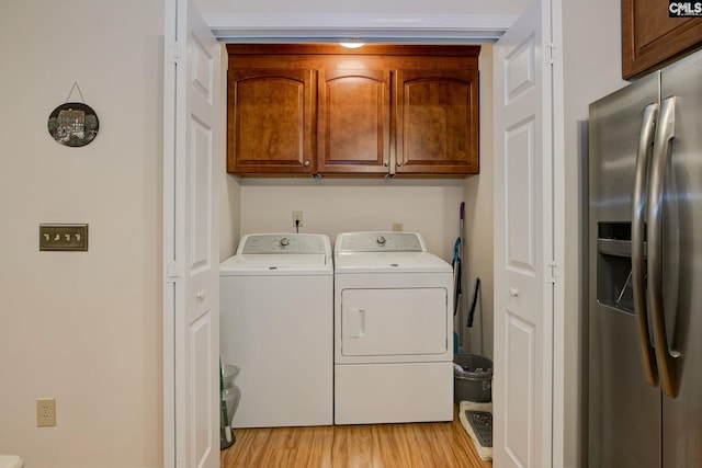122 Halling Dr, Columbia, SC 29229 - laundry area with separate washer and dryer, cabinet space, and light wood-style floors