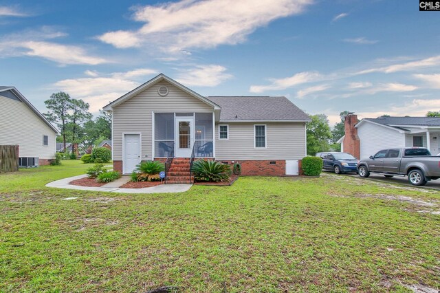 122 Halling Dr, Columbia, SC 29229 - ranch-style home with a sunroom, a front lawn, and a shingled roof