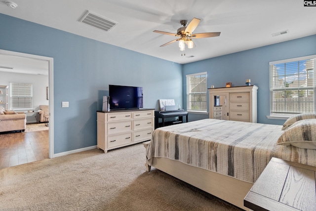 1420 Fair Forest Ln, Chapin, SC 29036 - carpeted bedroom featuring multiple windows and a ceiling fan
