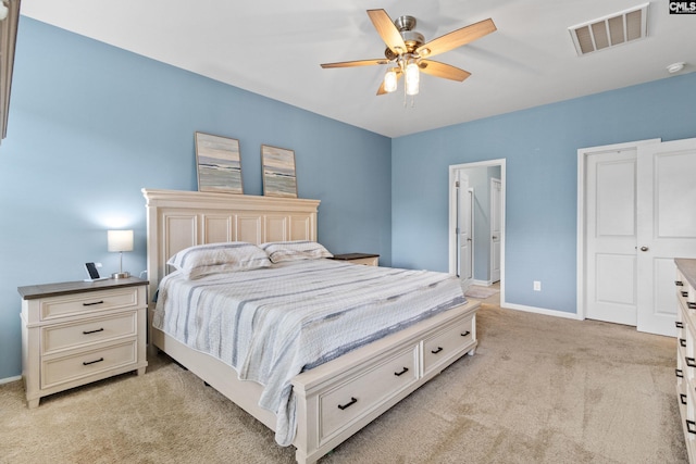 1420 Fair Forest Ln, Chapin, SC 29036 - bedroom with light carpet, ceiling fan, and connected bathroom