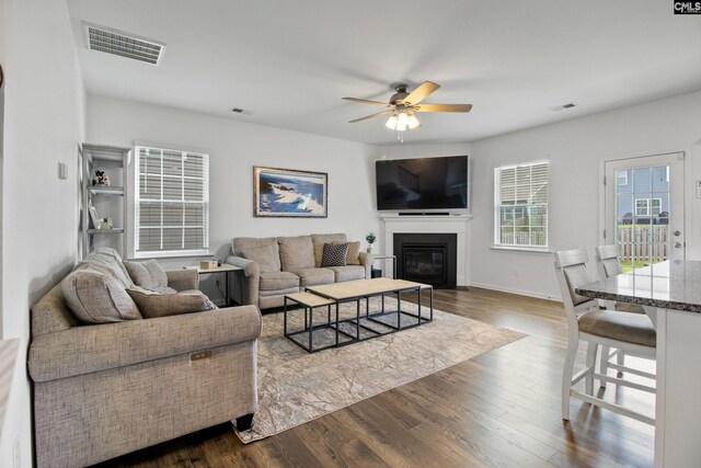 1420 Fair Forest Ln, Chapin, SC 29036 - living room with ceiling fan, dark wood-style flooring, and a fireplace with flush hearth