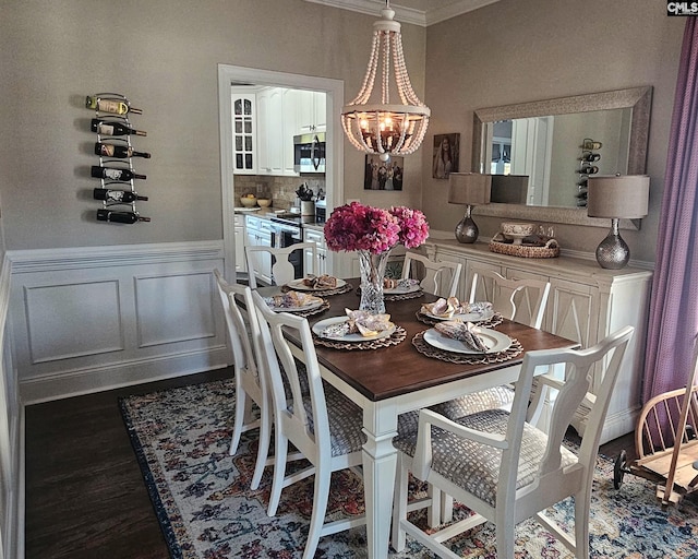 115 Lake Hilton Dr, Chapin, SC 29036 - dining area featuring ornamental molding, a chandelier, wood finished floors, and a wainscoted wall