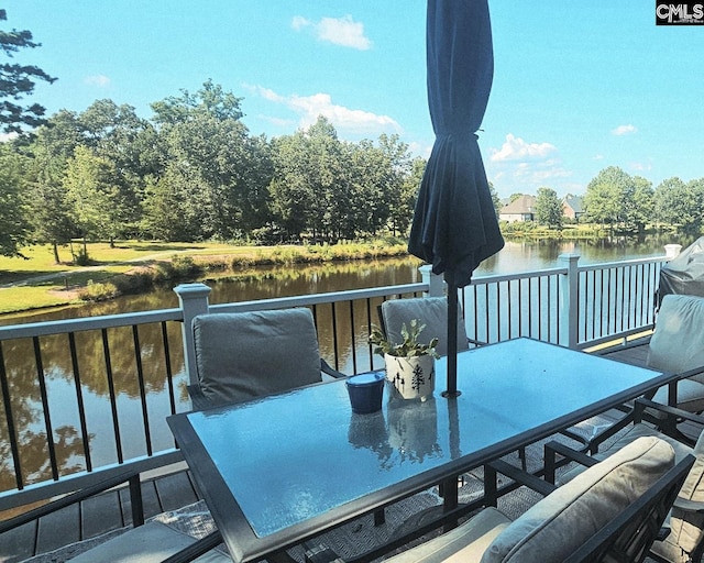 115 Lake Hilton Dr, Chapin, SC 29036 - wooden terrace with outdoor dining space and a water view