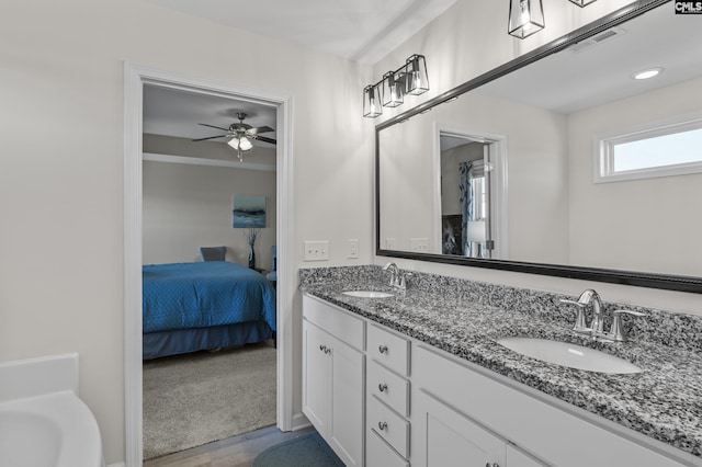 345 Wahoo Cir, Irmo, SC 29063 - bathroom featuring connected bathroom, double vanity, a ceiling fan, and wood finished floors