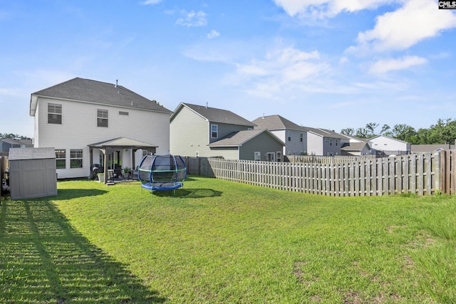 345 Wahoo Cir, Irmo, SC 29063 - fenced backyard with a trampoline, a gazebo, a storage shed, and a residential view