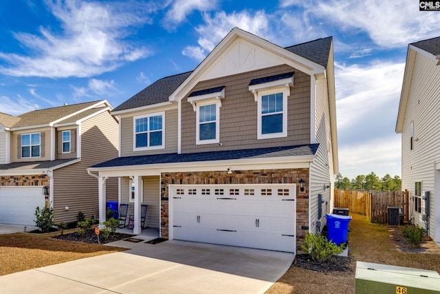1013 Ashcroft Cir, Columbia, SC 29229 - craftsman-style home with an attached garage, stone siding, concrete driveway, and a porch