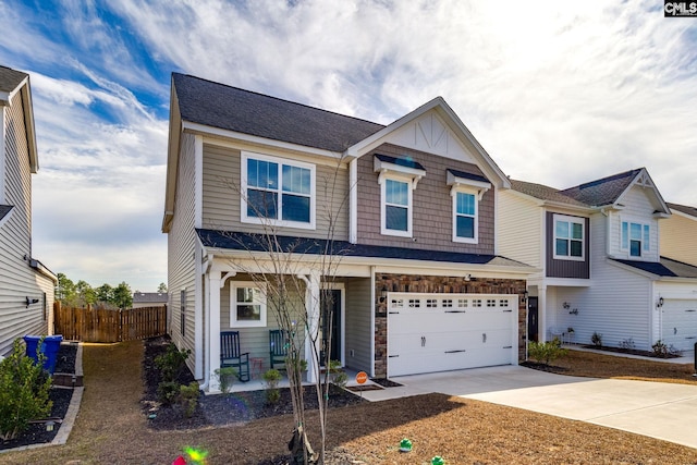 1013 Ashcroft Cir, Columbia, SC 29229 - view of front of house featuring a porch, driveway, a garage, and stone siding