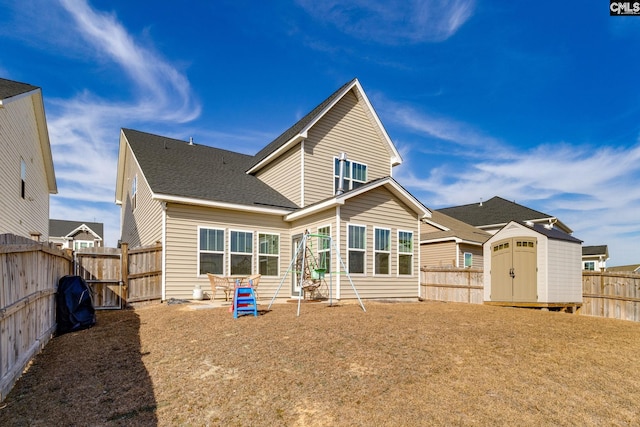 1013 Ashcroft Cir, Columbia, SC 29229 - back of house with a shed and a fenced backyard