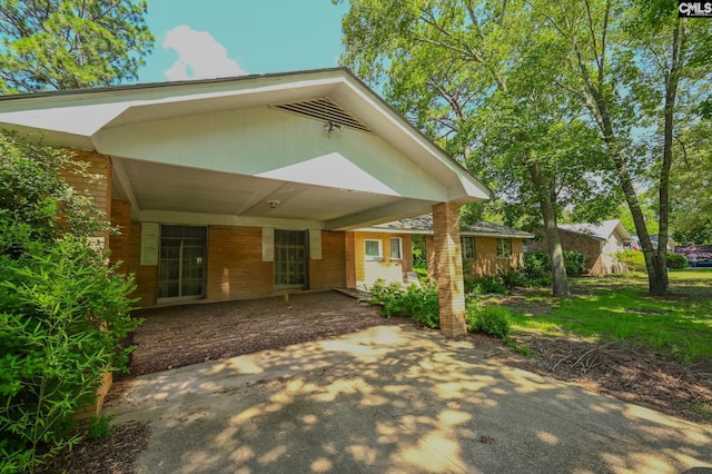 1206 Furman Dr, Sumter, SC 29154 - back of house with a carport and brick siding
