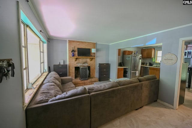 1206 Furman Dr, Sumter, SC 29154 - living area with ornamental molding, light colored carpet, and a wood stove