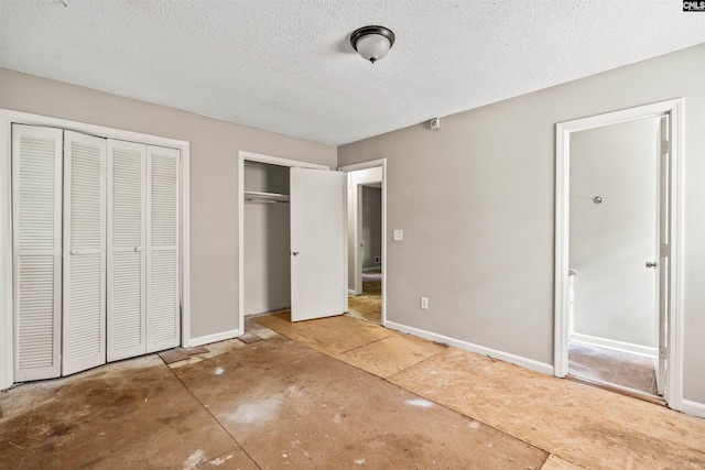 247 Piney Grove Rd, Columbia, SC 29210 - unfurnished bedroom with multiple closets and a textured ceiling