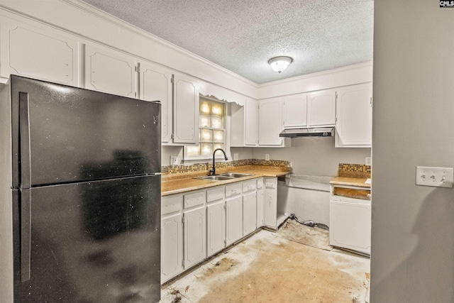 247 Piney Grove Rd, Columbia, SC 29210 - kitchen featuring freestanding refrigerator, under cabinet range hood, a textured ceiling, white cabinetry, and unfinished concrete flooring