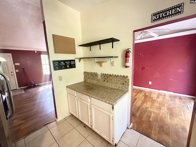 121 Durham Creek Ct, Columbia, SC 29229 - kitchen with ceiling fan, a textured ceiling, white cabinets, light wood-style floors, and open shelves