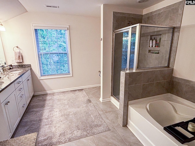 15 Alumni Ln, Blythewood, SC 29016 - full bath with a shower stall, a bath, double vanity, lofted ceiling, and tile patterned floors
