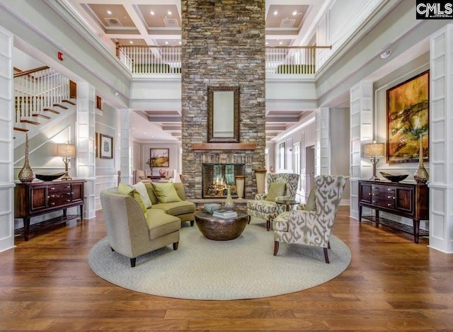 15 Alumni Ln, Blythewood, SC 29016 - living room featuring a high ceiling, recessed lighting, a fireplace, wood finished floors, and crown molding