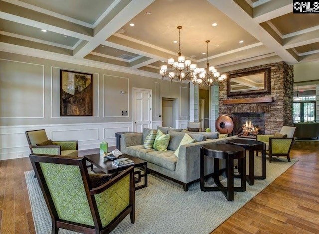 15 Alumni Ln, Blythewood, SC 29016 - living room with wood finished floors, beamed ceiling, a chandelier, a fireplace, and coffered ceiling