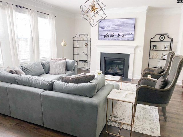 15 Alumni Ln, Blythewood, SC 29016 - living room featuring crown molding, dark wood-type flooring, and a glass covered fireplace