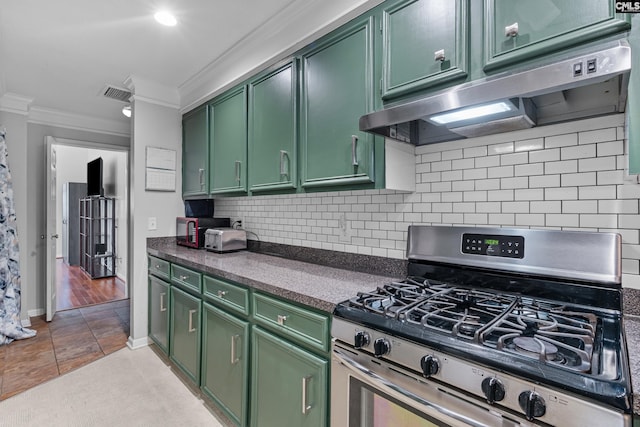 108 Sawgrass Ct, West Columbia, SC 29172 - kitchen with green cabinets, stainless steel range with gas cooktop, under cabinet range hood, ornamental molding, and dark countertops