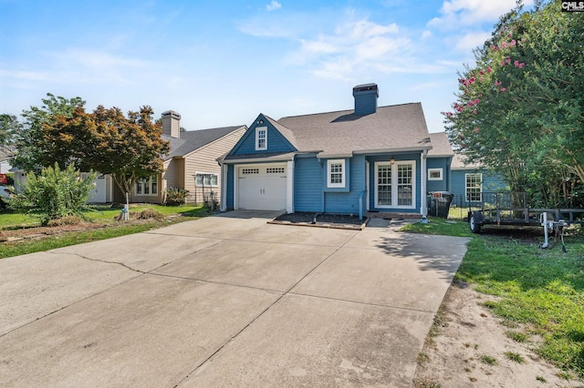 108 Sawgrass Ct, West Columbia, SC 29172 - view of front of house with a garage, driveway, a front lawn, and french doors