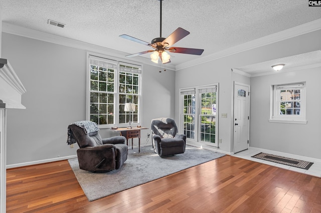 108 Sawgrass Ct, West Columbia, SC 29172 - living area featuring hardwood / wood-style flooring, ceiling fan, plenty of natural light, a textured ceiling, and crown molding